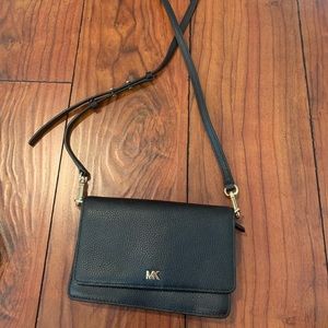 Black MK Crossbody with cardholder and multiple pockets.